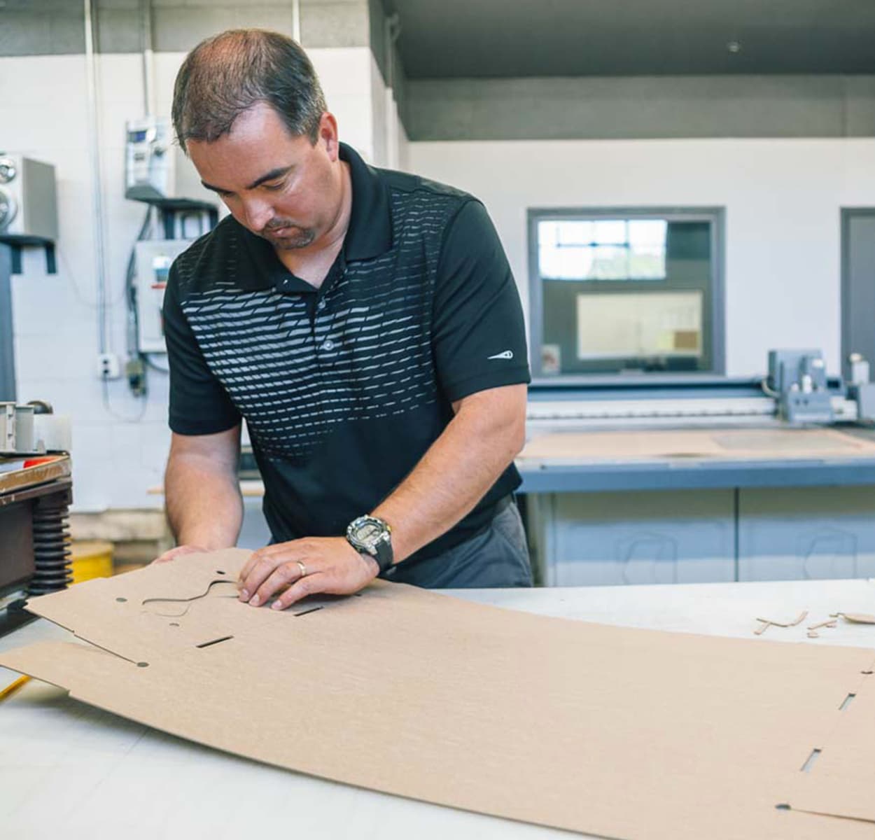 Employee working on paperboard