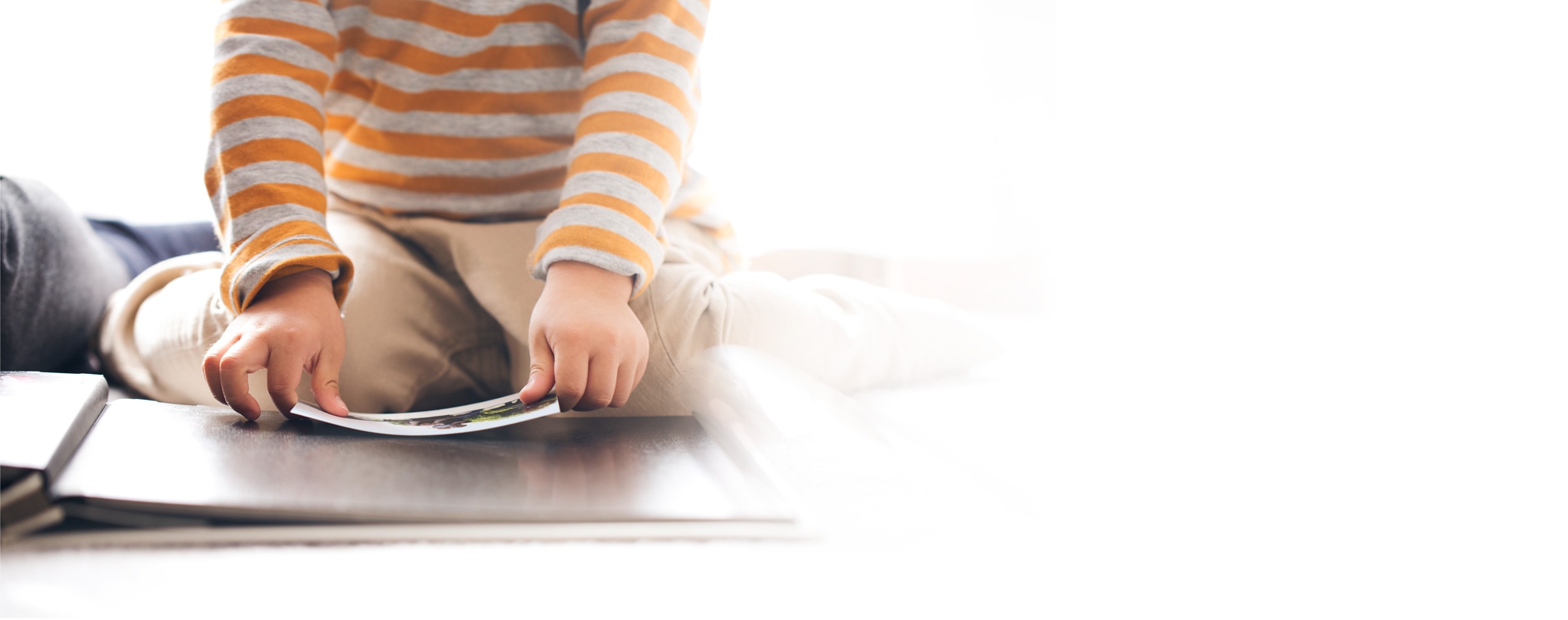 Kid working on scrapbook