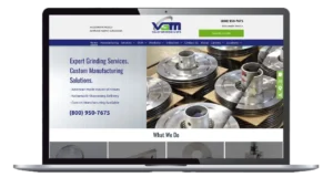 Valley Grinding homepage displayed on laptop