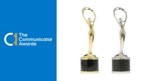 Two statue awards - one gold and one silver.