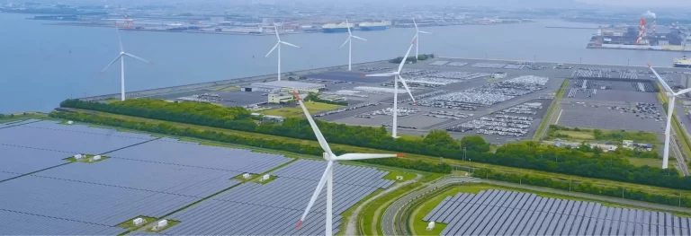 aerial view of windmills and solar panels
