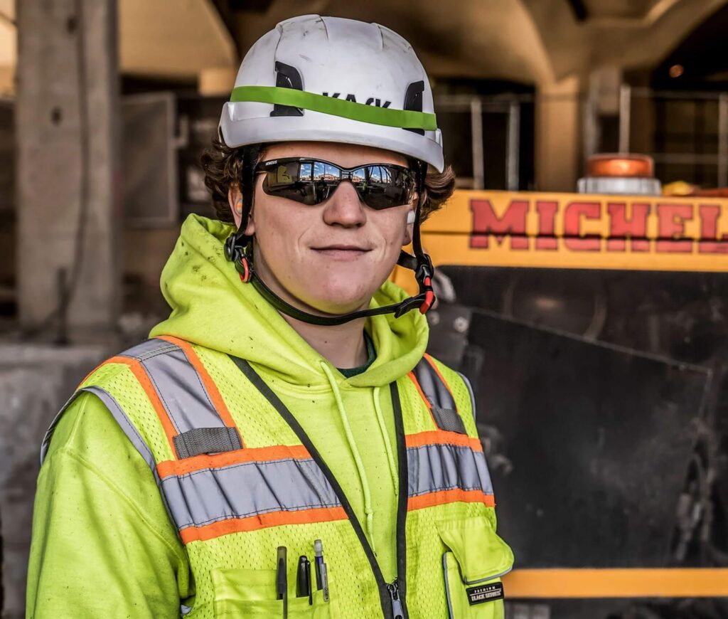 Michels' employee in safety vest and helmet